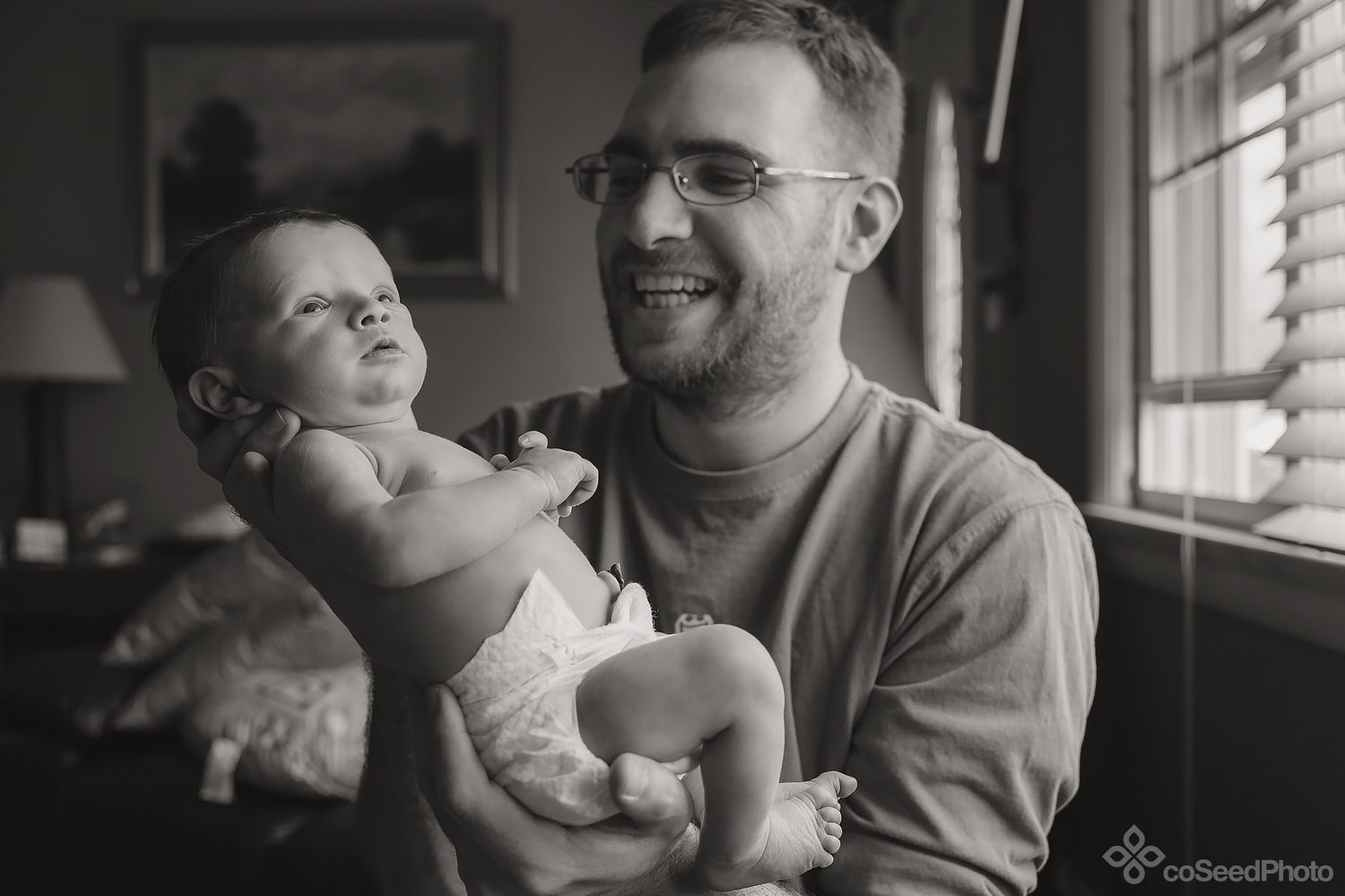 Matt holds Declan up to the window.