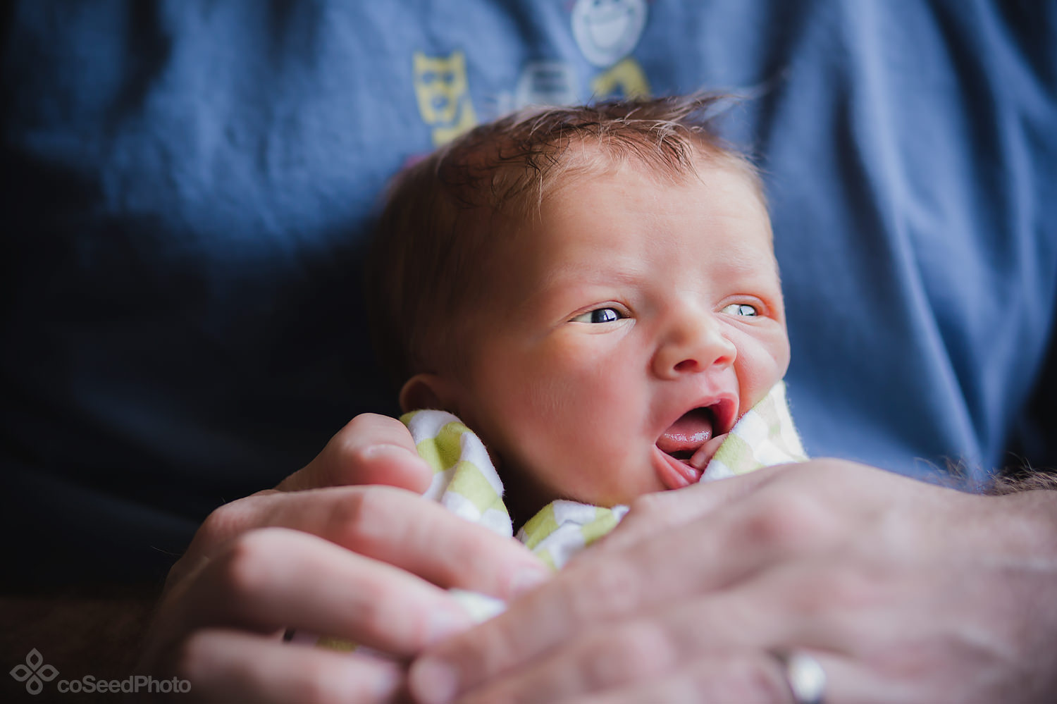 Newborn Declan gazes outside.