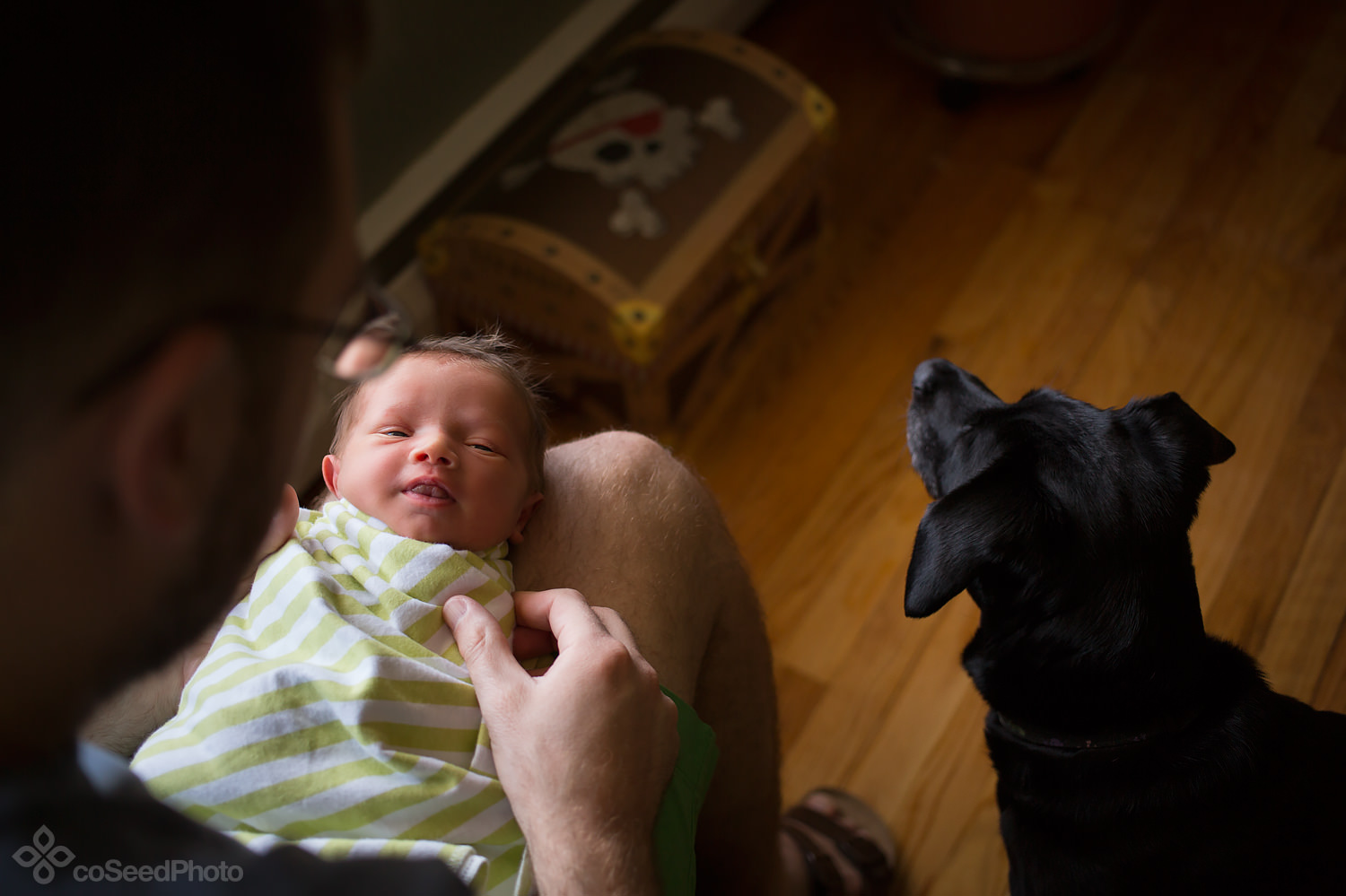 Newborn Declan gets swaddled.