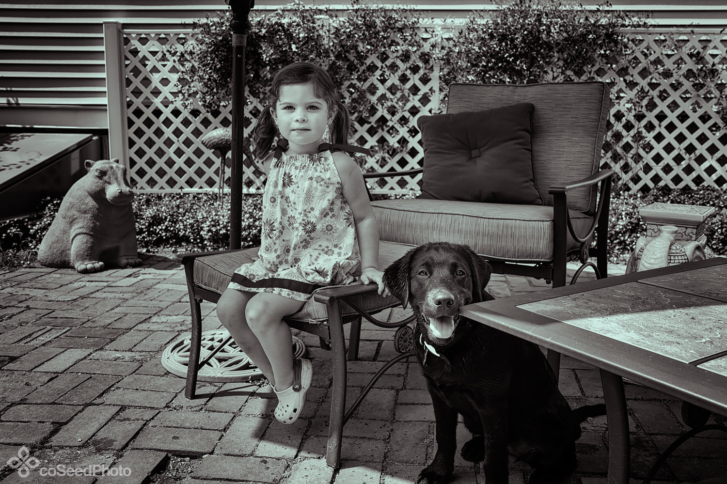 Elise and pup Wichita sit on the patio.