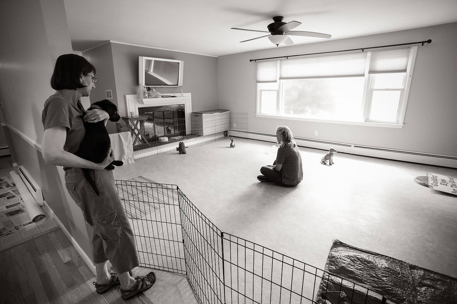 Guiding Eyes volunteer holds black lab pup before Pup Test.